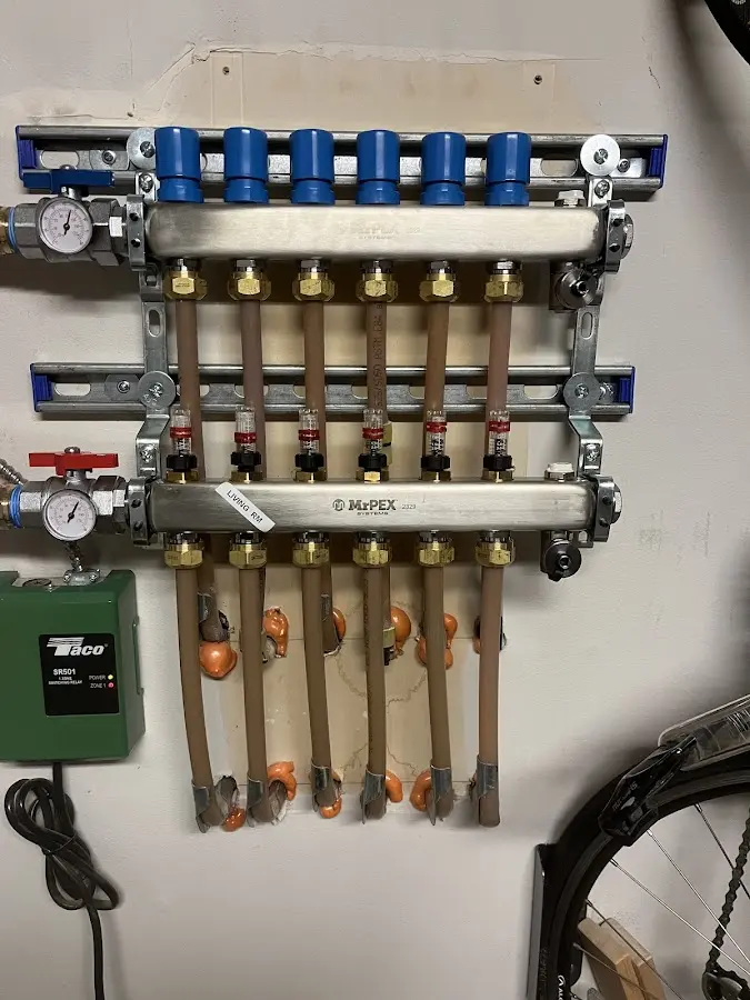 Plumber performing Water Heater Repair at a residential property in Waukesha